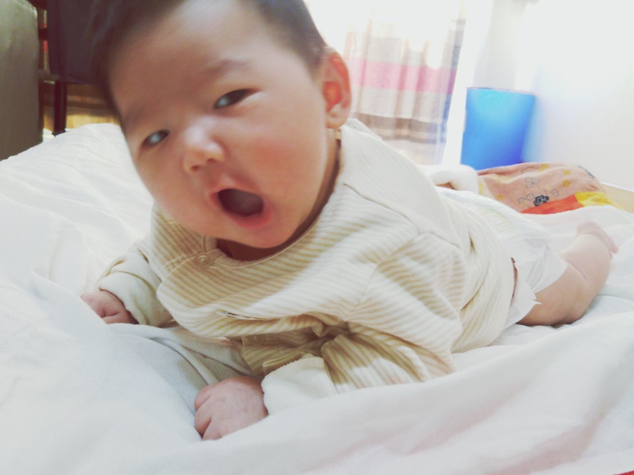 baby, indoors, bed, childhood, innocence, babyhood, toddler, cute, one person, bedroom, real people, home interior, yawning, pacifier, stuffed toy, pillow, close-up, babies only, day, people