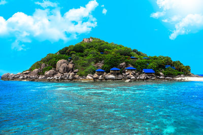 Scenic view of sea against blue sky