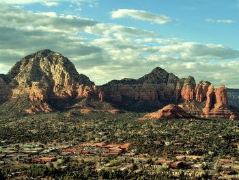 View of rock formation on mountain against sky