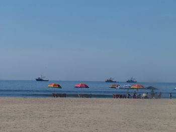 Scenic view of beach against clear sky