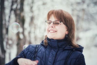 Portrait of smiling young woman outdoors