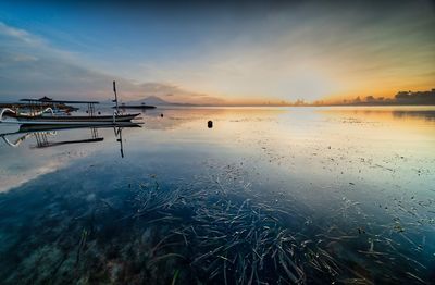 Scenic view of sea against sky during sunset