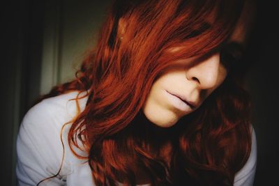Close-up of woman with redhead