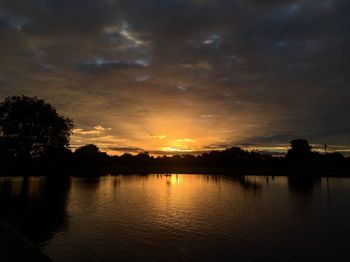 Scenic view of lake against sky during sunset