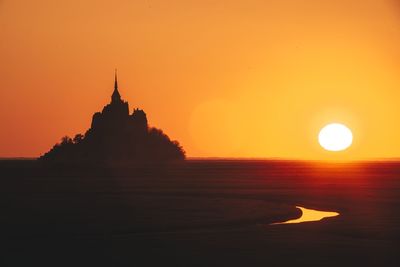 The mont saint-michel bay in normandy at sunset