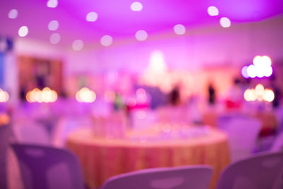 Defocused image of empty seats in restaurant