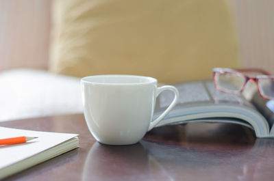 Close-up of coffee cup on table