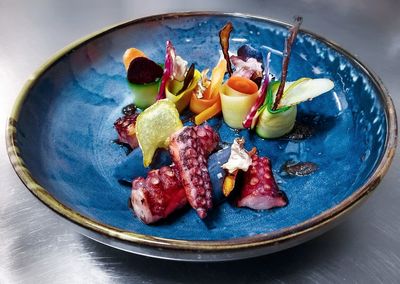 Close-up of fruits in plate on table