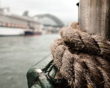 Close-up of rope on wet pole