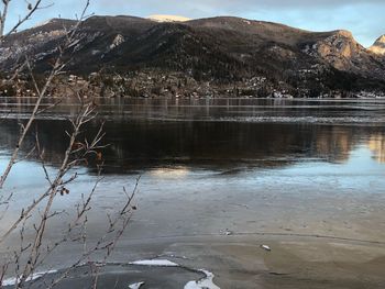 Scenic view of lake against mountain range