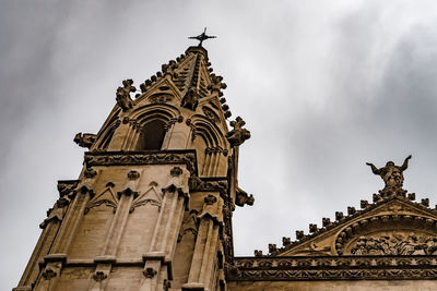 Low angle view of statue of temple against sky