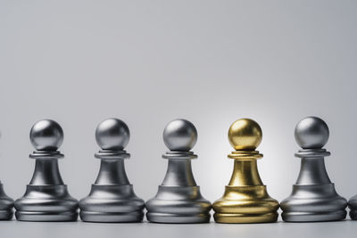 Close-up of chess pieces against white background