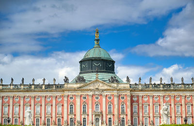 Building against cloudy sky