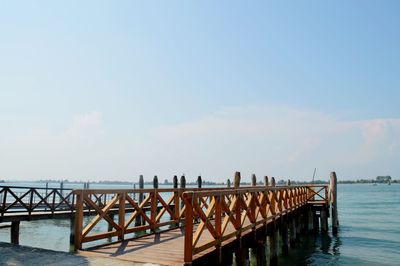 Pier over sea against sky