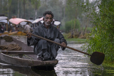 Man standing on riverbank