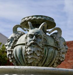 Low angle view of statue against sky