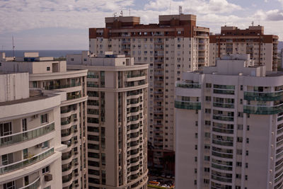 High angle view of buildings in city against sky