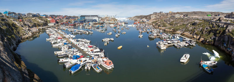 High angle view of boats moored in sea against sky