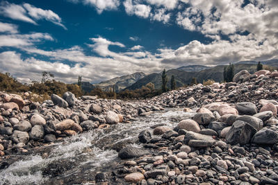 Rocks on land against sky