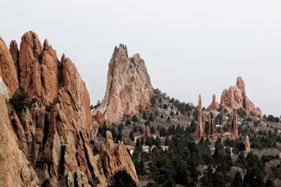 Panoramic view of rocky mountains against clear sky