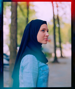 Portrait of young woman looking away