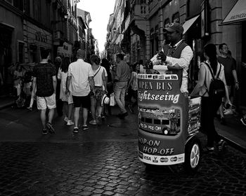 People walking on street in city