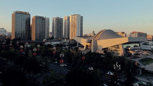 High angle view of street amidst buildings against sky