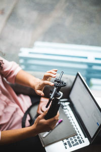 High angle view of woman using mobile phone