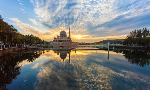 Putrajaya lake with reflection of putra mosque during sunset