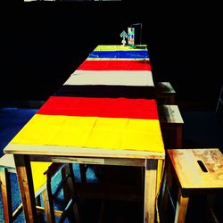 High angle view of multi colored chairs on table