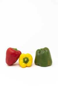 Close-up of bell peppers against white background