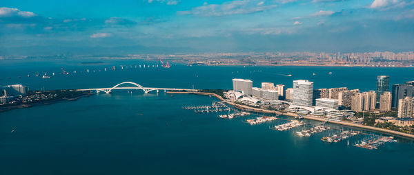 View of bridge over bay against buildings in city