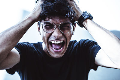 Close-up portrait of man wearing sunglasses