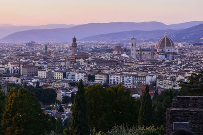 View of cityscape against sky during sunset