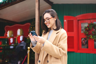 Young woman using mobile phone