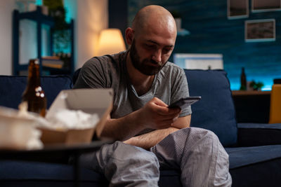 Young man using mobile phone