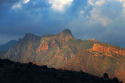 Rocky mountains against clouds