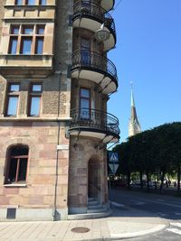 Low angle view of tower against blue sky