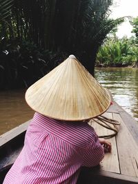 Man on hammock by trees