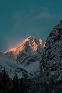 Scenic view of snowcapped mountains against sky during winter