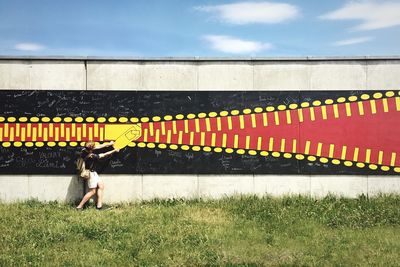 Woman standing on grass