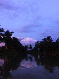 Scenic view of lake against sky at night