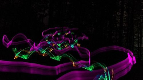 Close-up of multi colored lights against black background