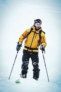 Full length of mid adult man in snow