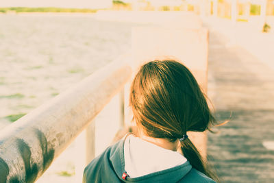 Rear view of woman standing outdoors