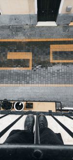 High angle view of shoes on railroad tracks