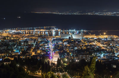 High angle view of illuminated buildings in city at night