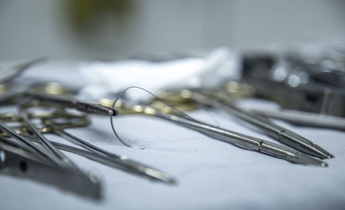 Close-up of barbed wire on table