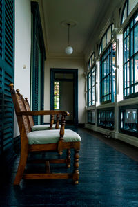 Empty chairs and table in room