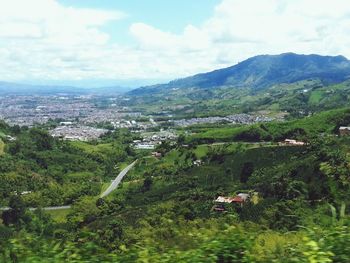 Scenic view of mountains against cloudy sky